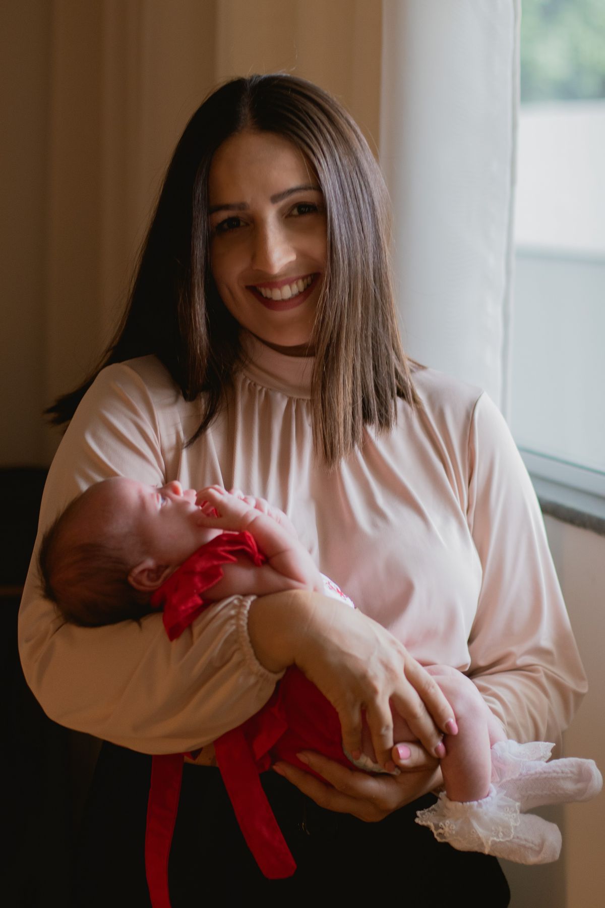 A mother holding her newborn